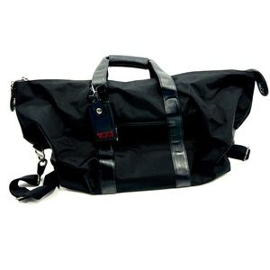 TUMI duffle bag in black with shoulder straps